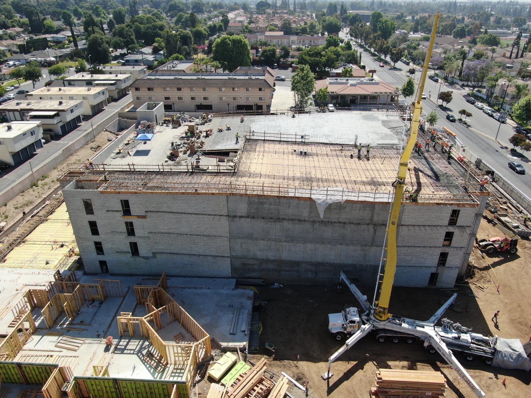 Aerial view of The Huntington Duarte wrap parking structure during concrete construction